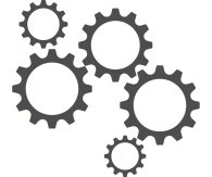 graue Zahnräder die ineinander greifen